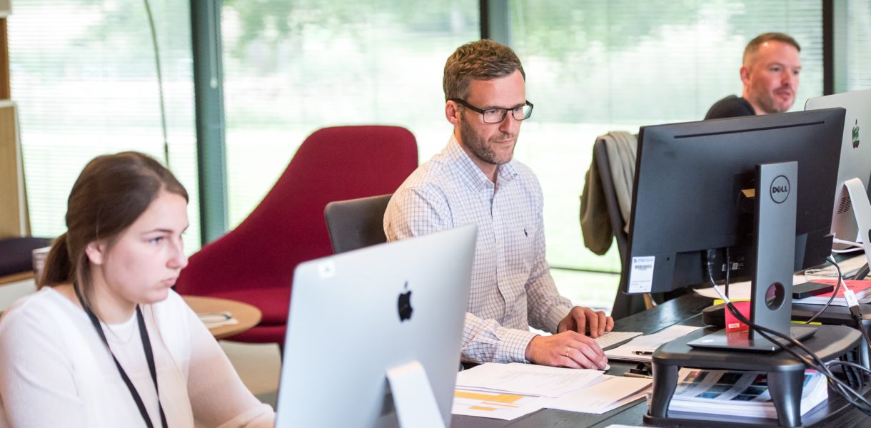 people working at computer at office