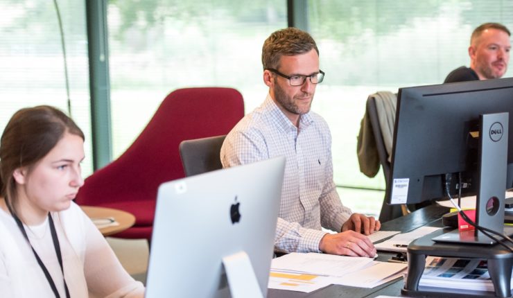 people working at computer at office