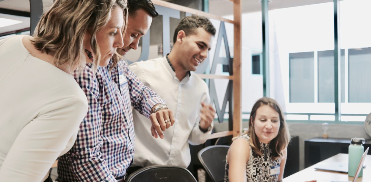 group of people looking at computer