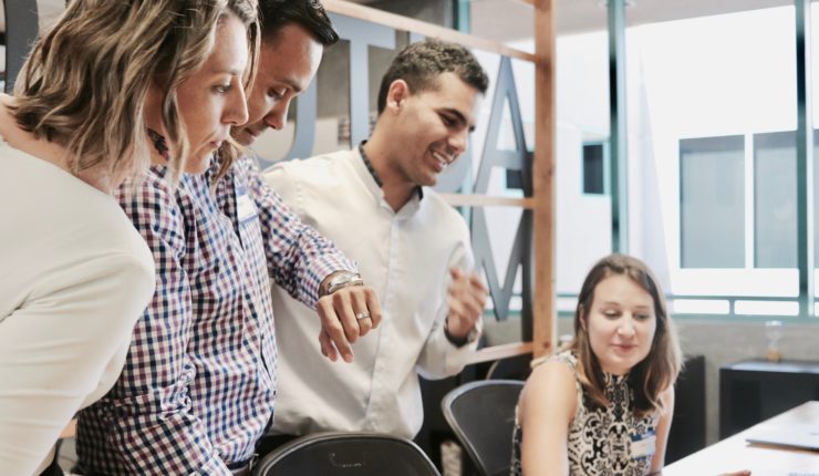 group of people looking at computer
