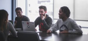 group of people looking at computer