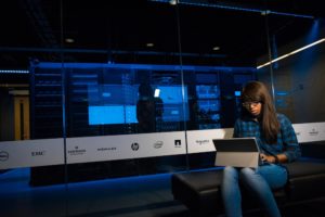 woman writing on computer