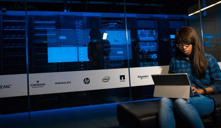 woman writing on computer