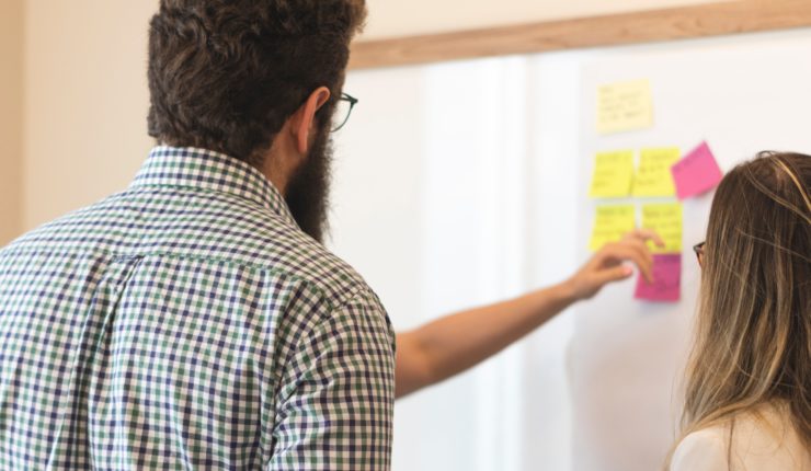 group of people using post it notes