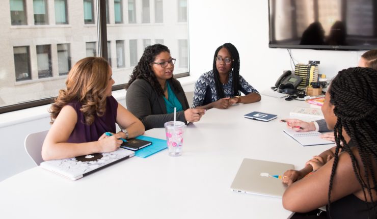 group of women sitting in office