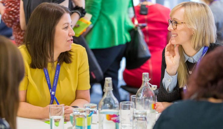 group of women sitting at table talking during DWP event