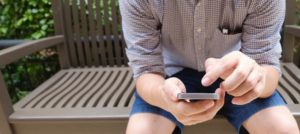 man sitting with phone