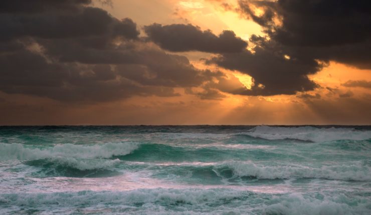 sun shining through skies