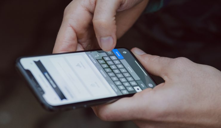 man holding smart phone