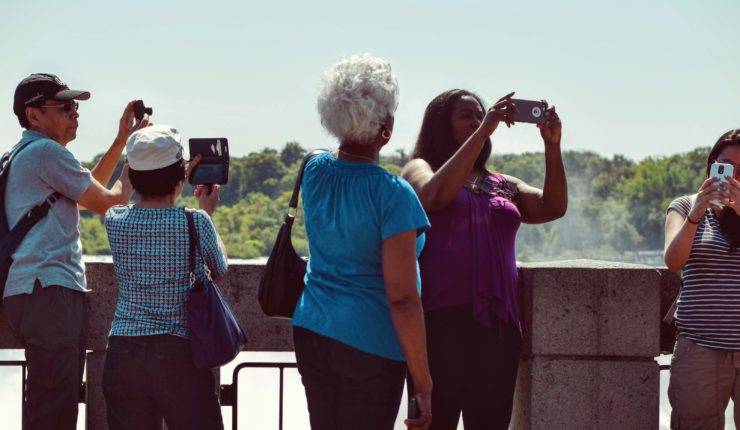 group of people taking photos