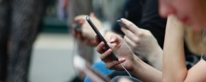 group of people using phones