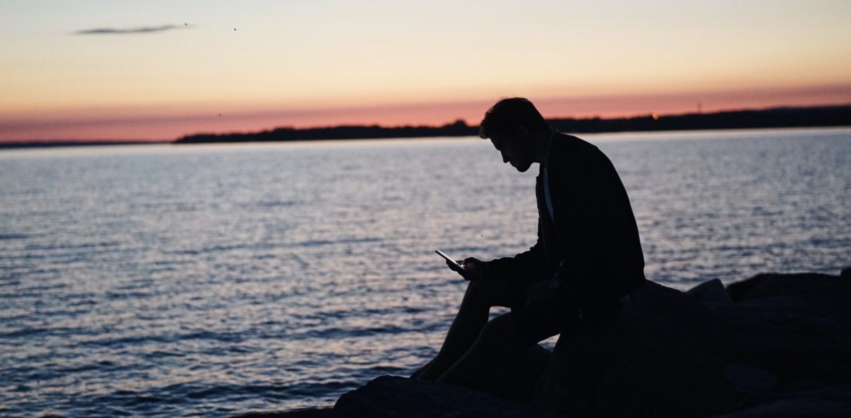 man sitting alone with phone