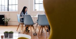 woman sitting at desk with computer