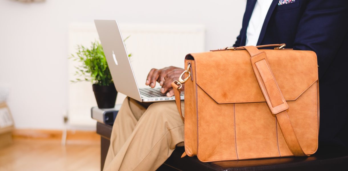 man sitting with breifcase