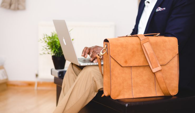 man sitting with breifcase