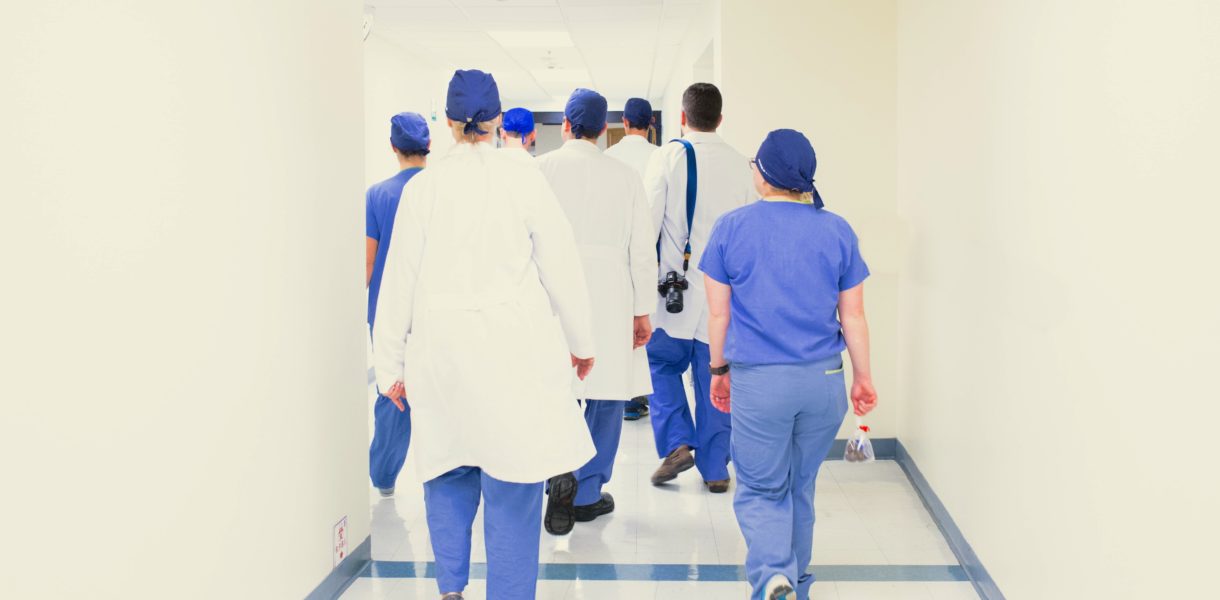 doctors and nurses walking down hallway
