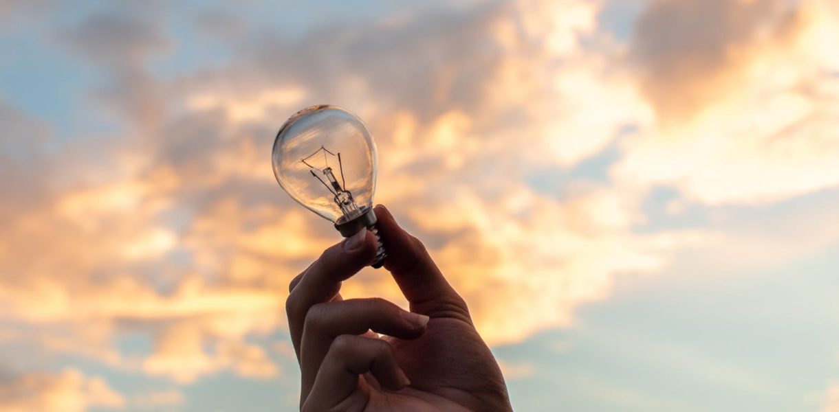 hand holding lighbulb