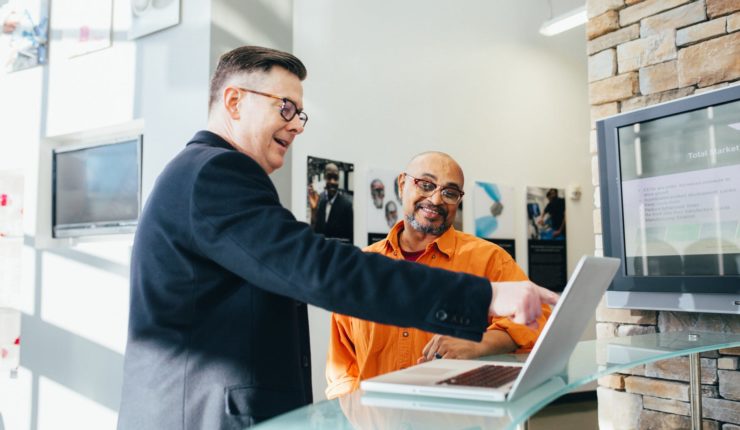 man pointing at laptop
