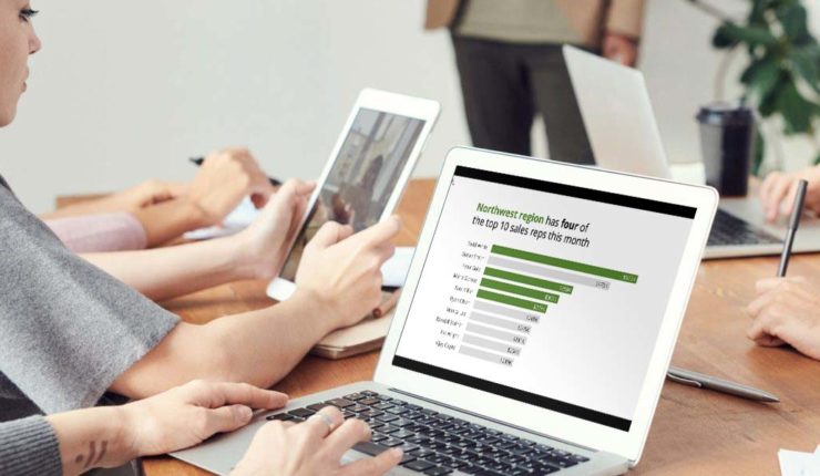 persons typing on computers, displaying data/graphic