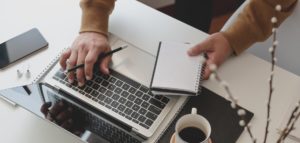 hands typing computer
