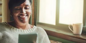 Lady smiling looking at phone