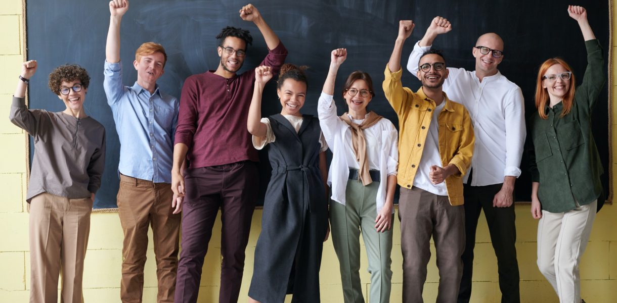 Students standing in front of blackboard