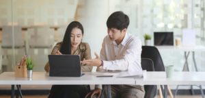 man and woman in a meeting