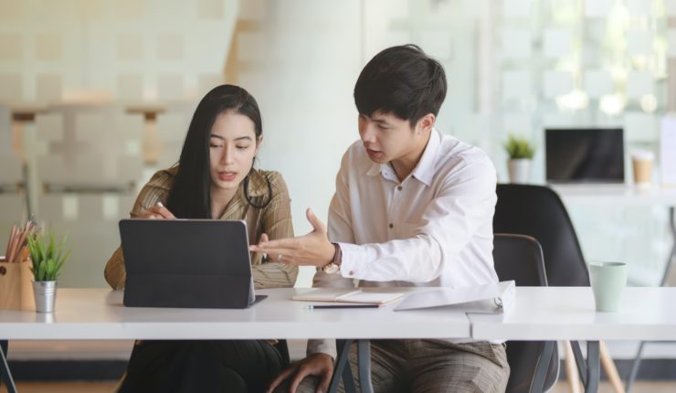 man and woman in a meeting