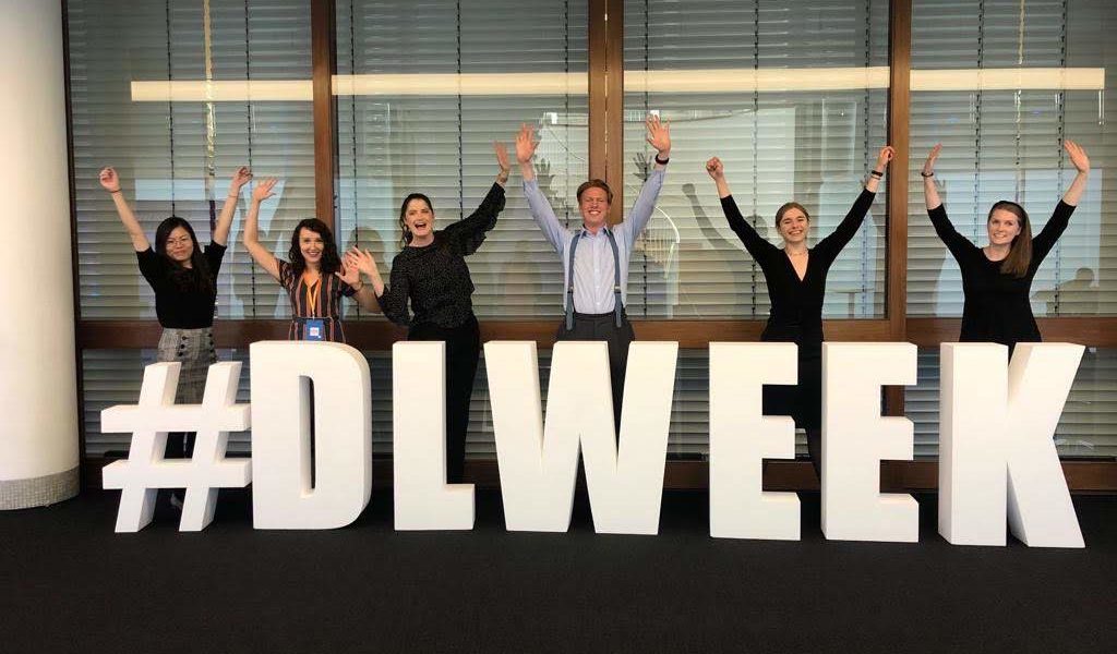 people standing behind#DLWeek19