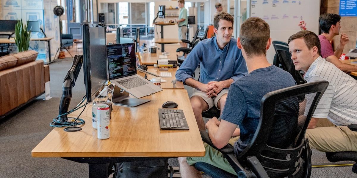 Lads talking in an office