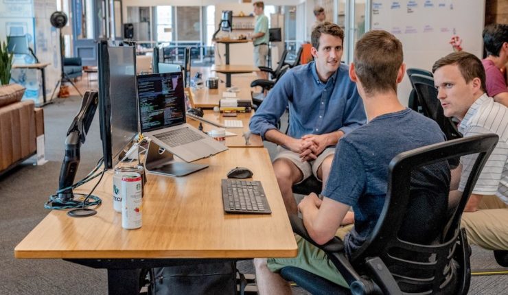 Lads talking in an office