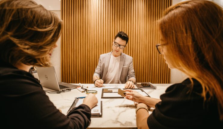 working round a table with laptops