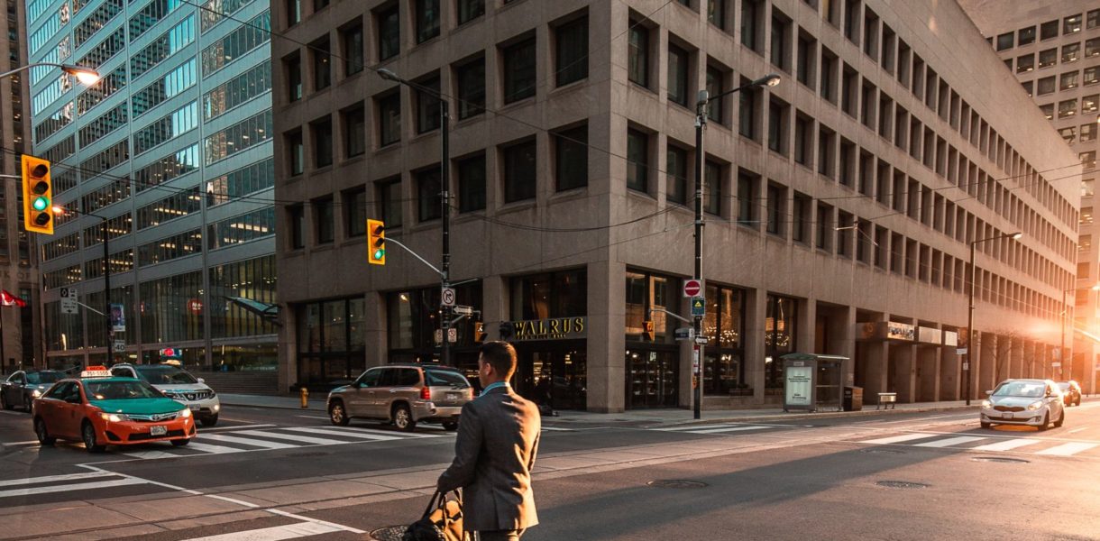 man walking on a zebra crossing