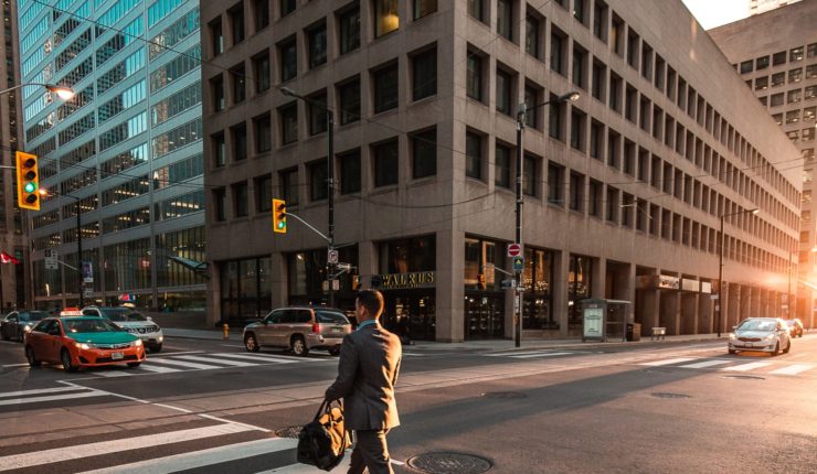 man walking on a zebra crossing
