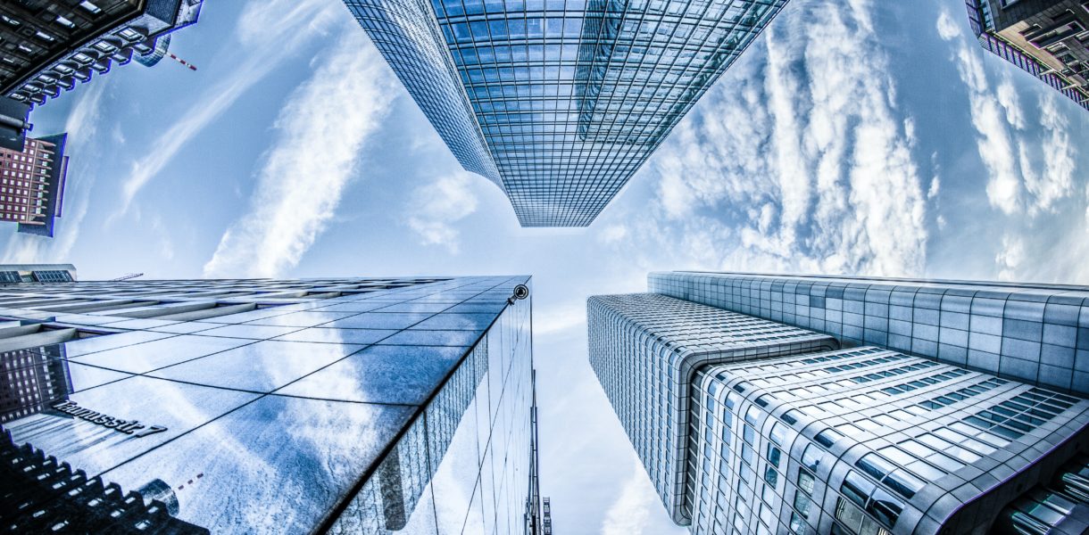 Low angle photo of 3 office blocks