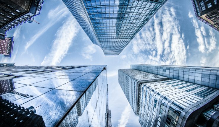 Low angle photo of 3 office blocks