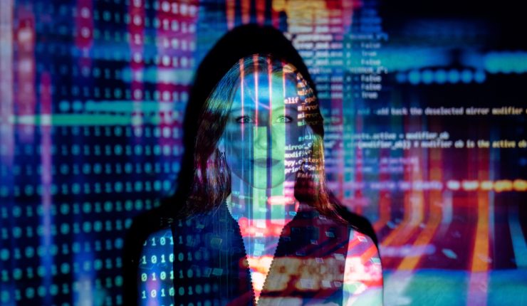 Woman stood in from a digital projector