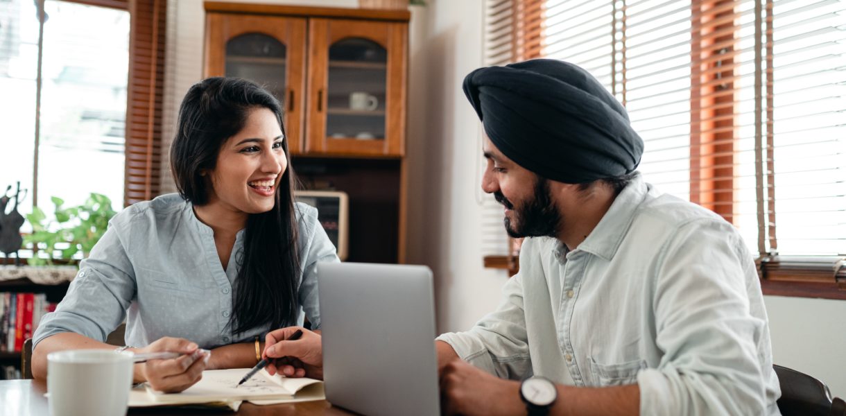 man and woman on laptop