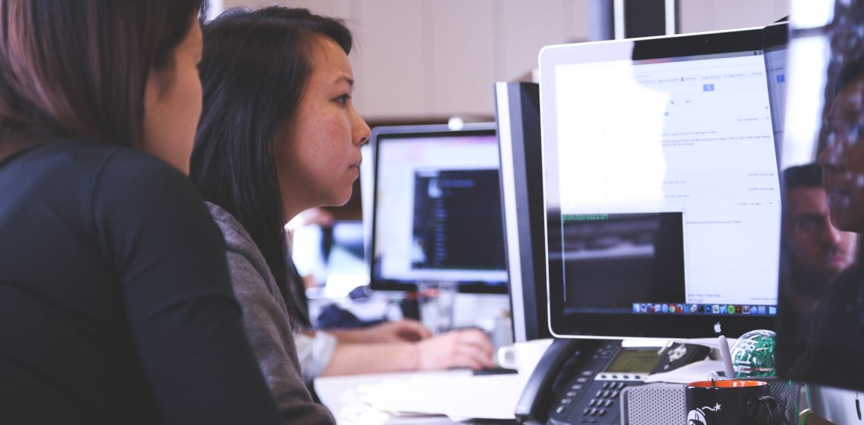 2 women working on a computer