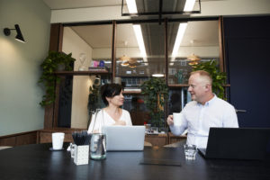 Man and woman having a meeting in boardroom