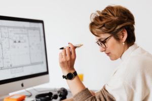 woman holding pencil