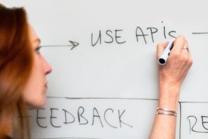 woman writing on board