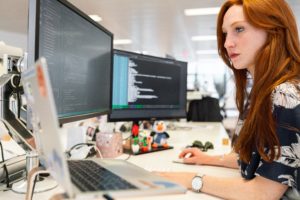 Woman working multy screens