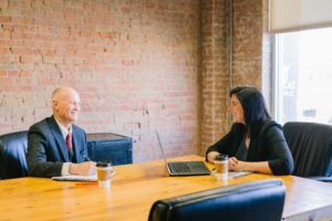 man and woman having a meeting