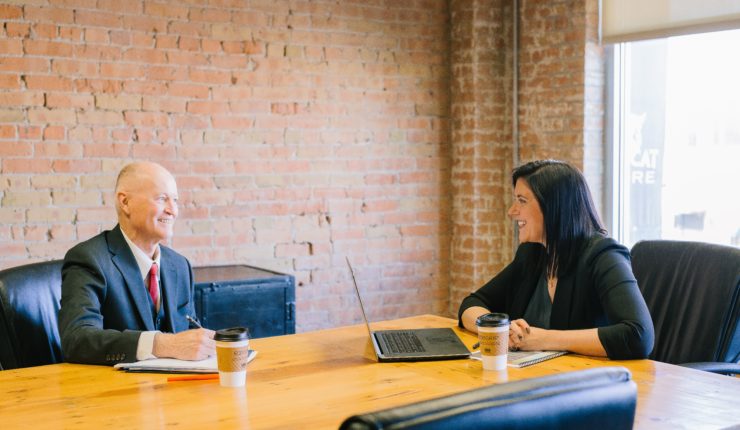 man and woman having a meeting