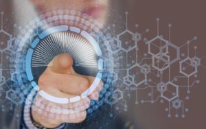 Man pointing on to a data screen