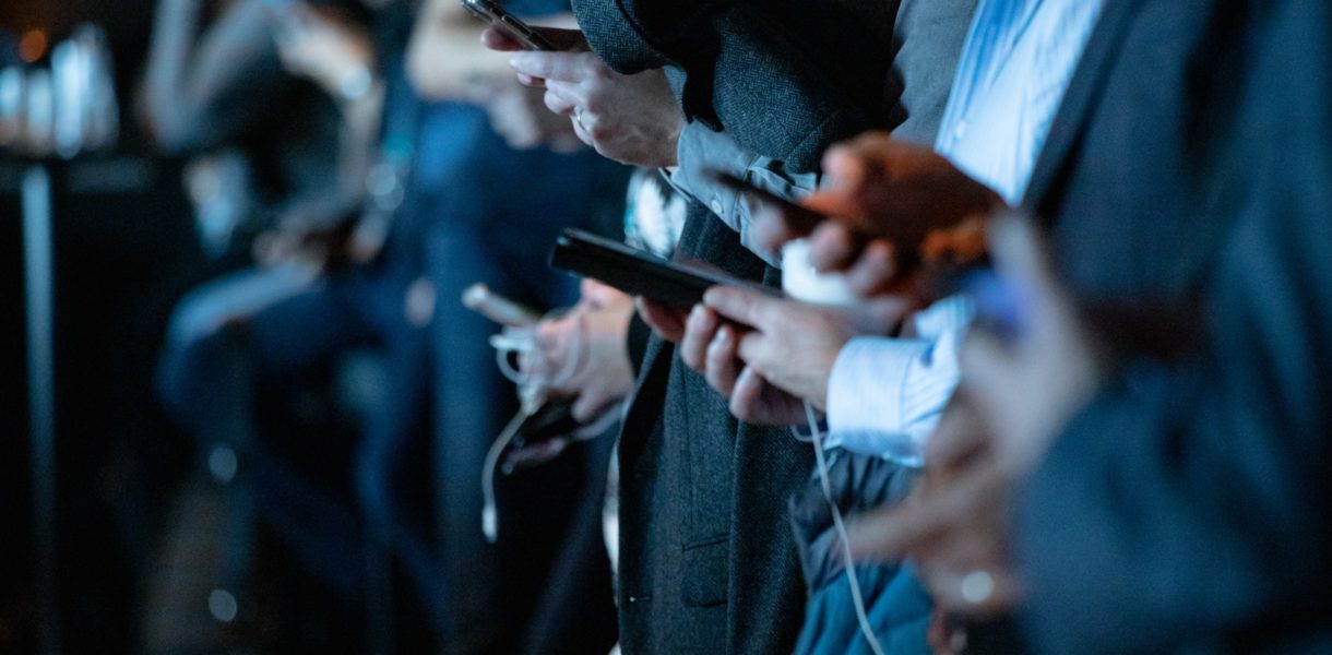 A line of people on phones