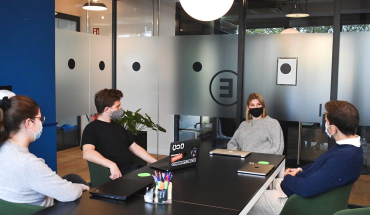team in the office wearing masks