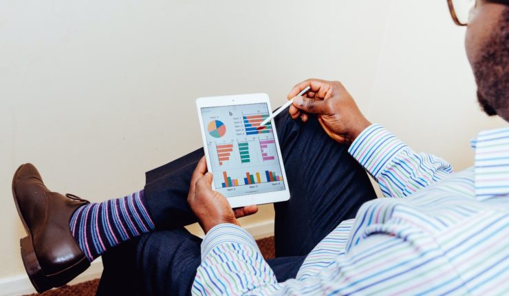 Man using data on an ipad