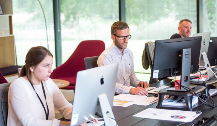 working in an office using desktops